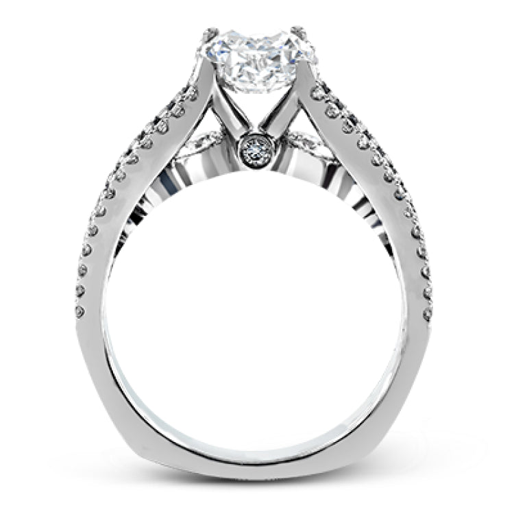 The lovely vintage style of this white gold engagement ring is further enhanced by .91 ctw of shimmering round cut diamonds.