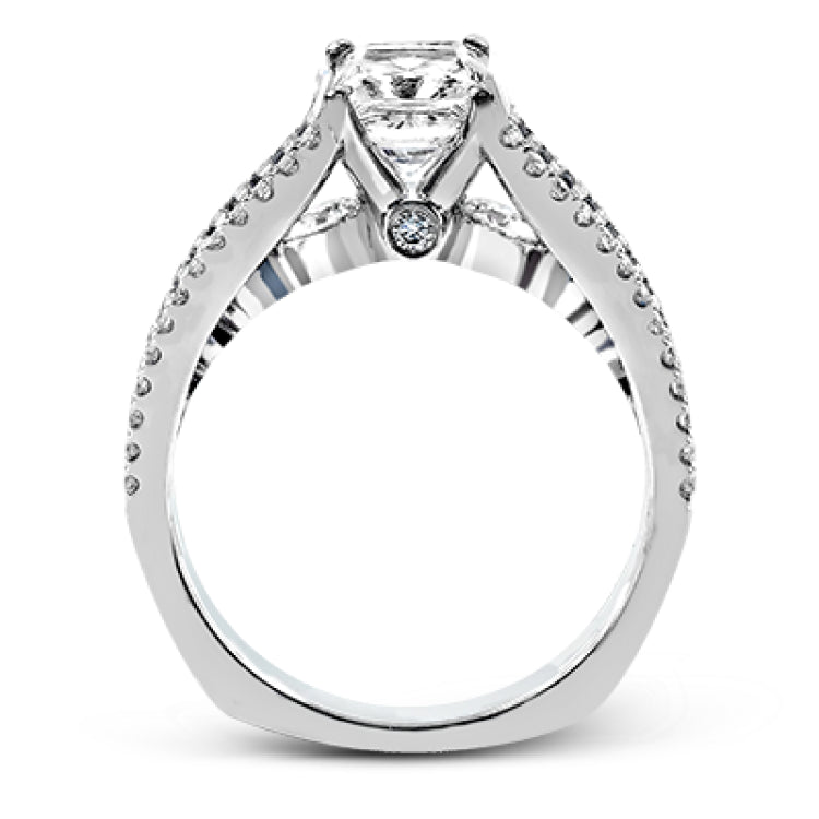 The lovely vintage style of this white gold engagement ring is further enhanced by .91 ctw of shimmering round cut diamonds.