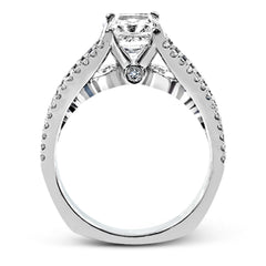 The lovely vintage style of this white gold engagement ring is further enhanced by .91 ctw of shimmering round cut diamonds.