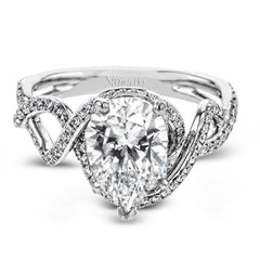 Classic with a modern twist, this white gold engagement ring features .50 ctw of sparkling white diamonds in a dramatic openwork design.