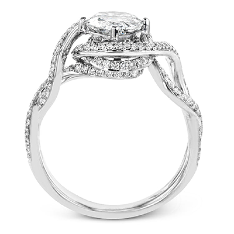 Classic with a modern twist, this white gold engagement ring features .50 ctw of sparkling white diamonds in a dramatic openwork design.