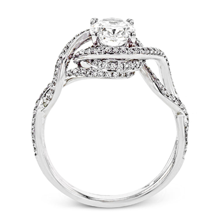 Classic with a modern twist, this white gold engagement ring features .50 ctw of sparkling white diamonds in a dramatic openwork design.