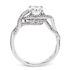Classic with a modern twist, this white gold engagement ring features .50 ctw of sparkling white diamonds in a dramatic openwork design.