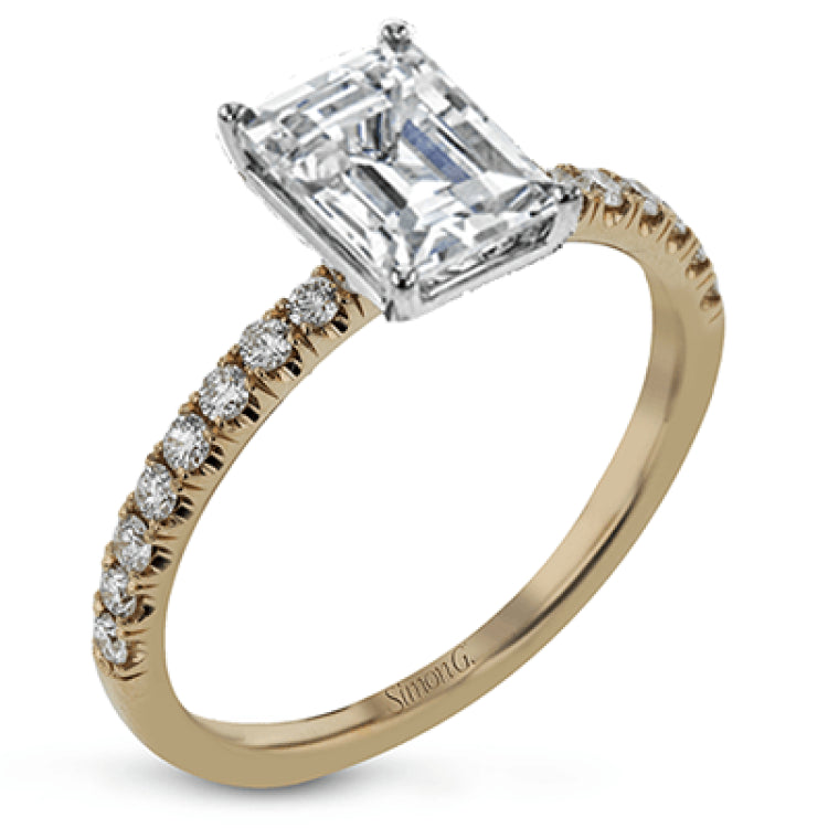 This distinctive bridal set design features a double-layer wedding band that fits around the engagement ring. The set contains .77 ctw of white diamonds.