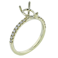 This distinctive bridal set design features a double-layer wedding band that fits around the engagement ring. The set contains .77 ctw of white diamonds.