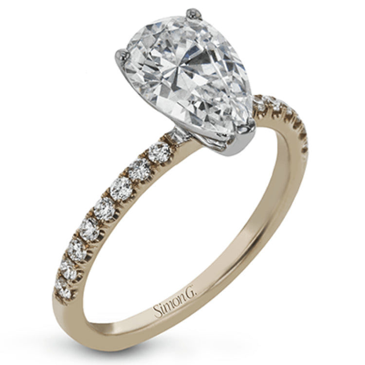 This distinctive bridal set design features a double-layer wedding band that fits around the engagement ring. The set contains .77 ctw of white diamonds.