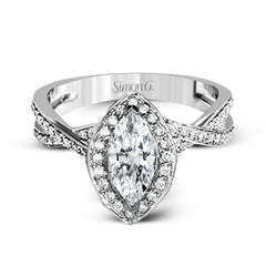 This sparkling modern engagement ring features an eye-catching twisted design with elegant classic halo accented by .29 ctw of shimmering round cut white diamonds.