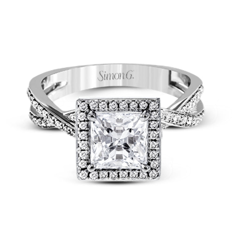 This sparkling modern engagement ring features an eye-catching twisted design with elegant classic halo accented by .29 ctw of shimmering round cut white diamonds.
