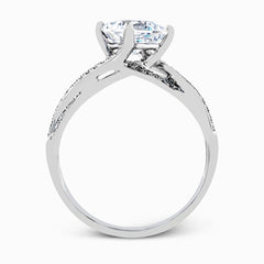 This sparkling modern white gold engagement ring and wedding band set features an eye-catching twisted design accented by .22 ctw of shimmering round cut white diamonds.