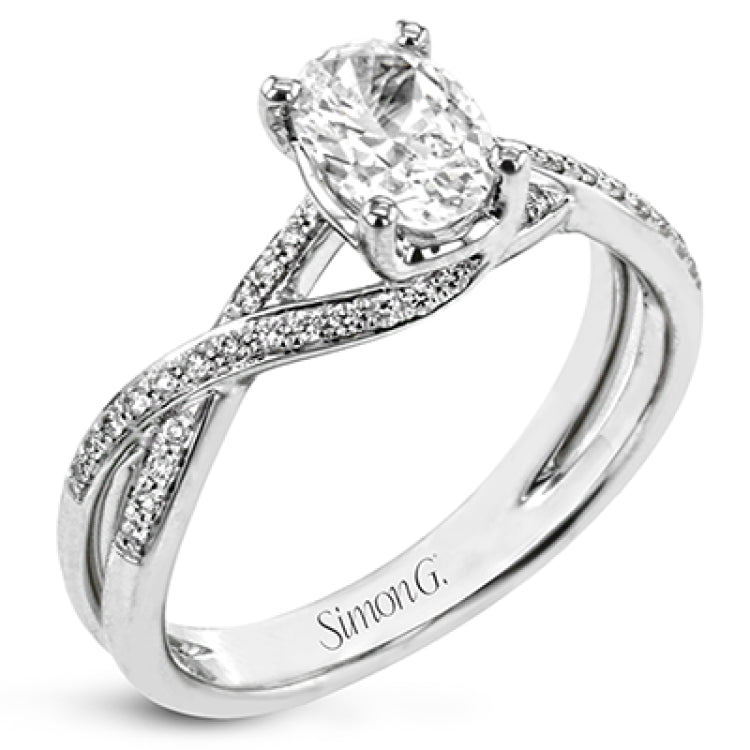 This sparkling modern white gold engagement ring and wedding band set features an eye-catching twisted design accented by .22 ctw of shimmering round cut white diamonds.