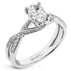 This sparkling modern white gold engagement ring and wedding band set features an eye-catching twisted design accented by .22 ctw of shimmering round cut white diamonds.