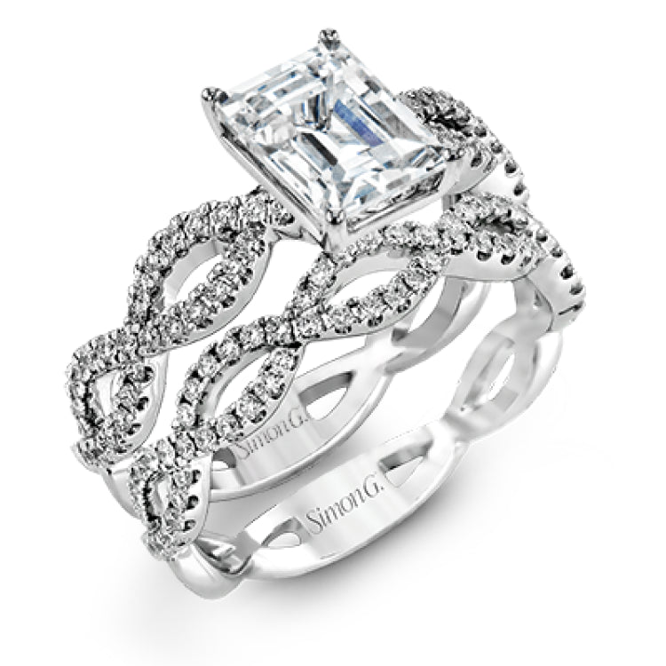 The intricate twisted design of this modern white gold engagement ring and wedding band set is set with .65 ctw of striking round cut white diamonds.