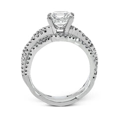 The intricate twisted design of this modern white gold engagement ring and wedding band set is set with .65 ctw of striking round cut white diamonds.