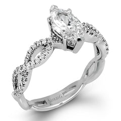 The intricate twisted design of this modern white gold engagement ring and wedding band set is set with .65 ctw of striking round cut white diamonds.