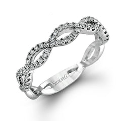 The intricate twisted design of this modern white gold engagement ring and wedding band set is set with .65 ctw of striking round cut white diamonds.