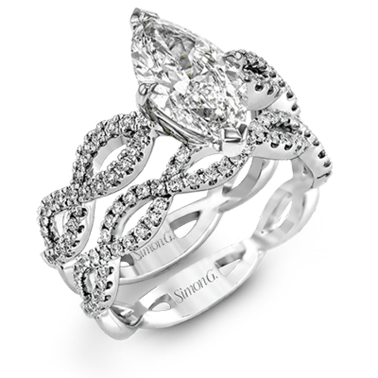The intricate twisted design of this modern white gold engagement ring and wedding band set is set with .65 ctw of striking round cut white diamonds.
