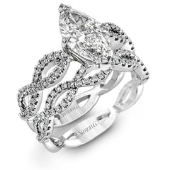 The intricate twisted design of this modern white gold engagement ring and wedding band set is set with .65 ctw of striking round cut white diamonds.