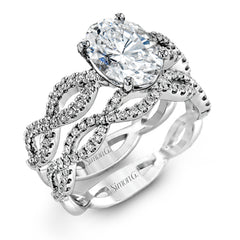The intricate twisted design of this modern white gold engagement ring and wedding band set is set with .65 ctw of striking round cut white diamonds.