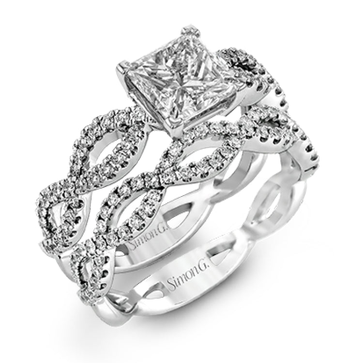 The intricate twisted design of this modern white gold engagement ring and wedding band set is set with .65 ctw of striking round cut white diamonds.
