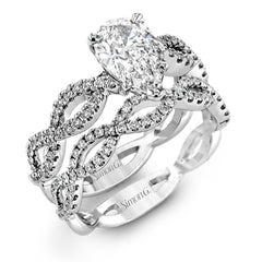 The intricate twisted design of this modern white gold engagement ring and wedding band set is set with .65 ctw of striking round cut white diamonds.