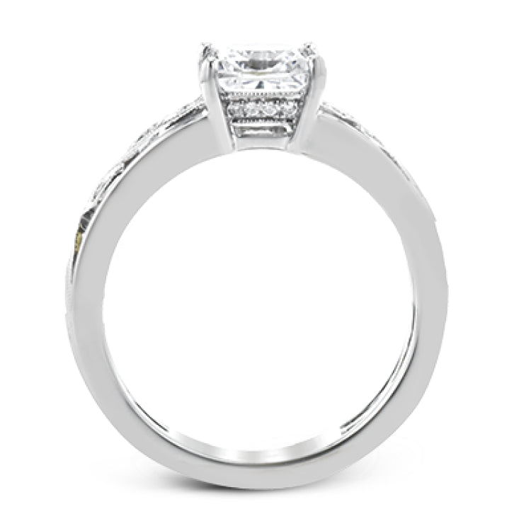 A delicate floral design highlights this vintage style engagement ring accented by .09 ctw of shimmering round cut white diamonds.