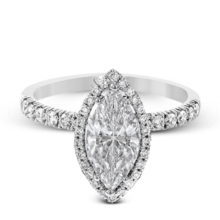 This elegant classic white gold halo engagement ring and band is set with .78 ctw of sparkling round cut white diamonds.