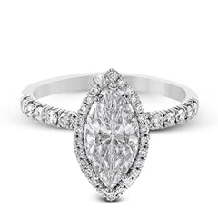 This elegant classic white gold halo engagement ring and band is set with .78 ctw of sparkling round cut white diamonds.