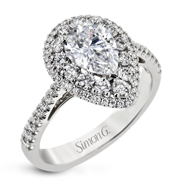 This 18k white gold engagement ring setting has a stunning double halo design set with .61 ctw of shining white round brilliant diamonds.