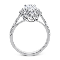 This 18k white gold engagement ring setting has a stunning double halo design set with .61 ctw of shining white round brilliant diamonds.