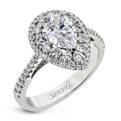This 18k white gold engagement ring setting has a stunning double halo design set with .61 ctw of shining white round brilliant diamonds.