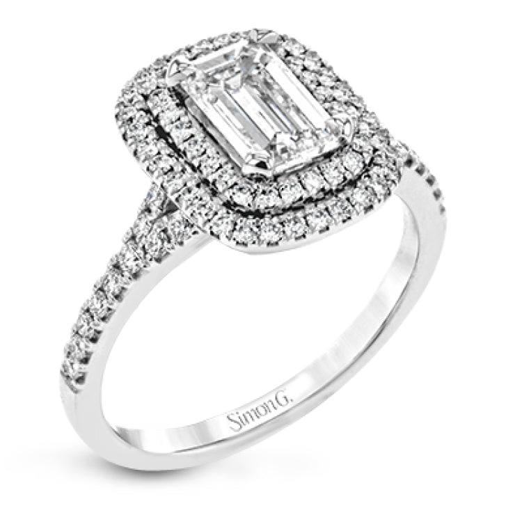 This beautiful, classic style setting features a double halo design built for an oval center stone. It contains .40 ctw of side diamonds.