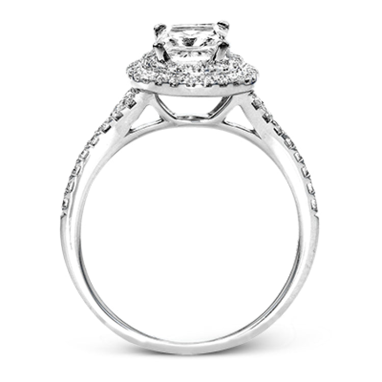 This beautiful, classic style setting features a double halo design built for an oval center stone. It contains .40 ctw of side diamonds.