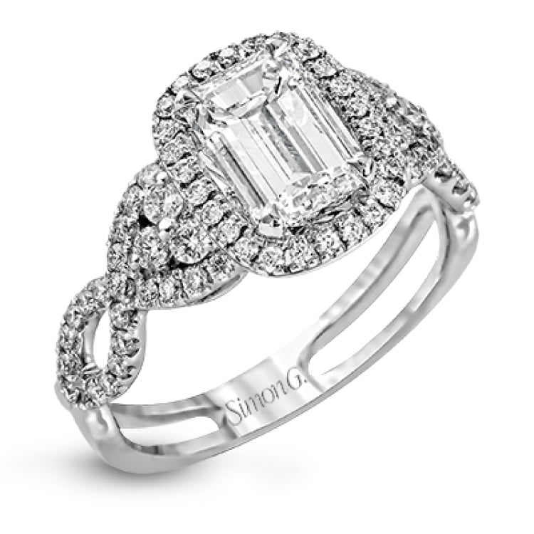 Reflecting an intricate modern design, this remarkable white gold ring is emphasized by a lovely halo complemented with .59 ctw round cut white diamonds.