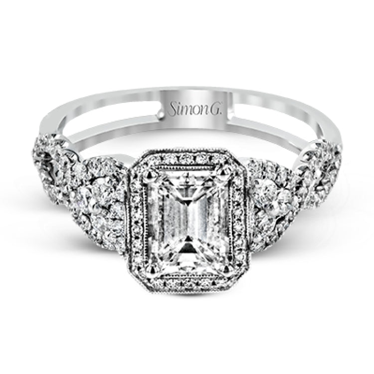 Reflecting an intricate modern design, this remarkable white gold ring is emphasized by a lovely halo complemented with .59 ctw round cut white diamonds.