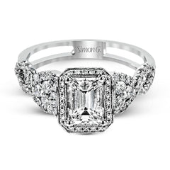 Reflecting an intricate modern design, this remarkable white gold ring is emphasized by a lovely halo complemented with .59 ctw round cut white diamonds.