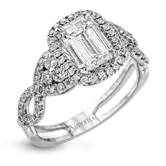 Reflecting an intricate modern design, this remarkable white gold ring is emphasized by a lovely halo complemented with .59 ctw round cut white diamonds.