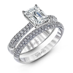 The classic design of this white gold engagement ring and wedding band set is emphasized by .72 ctw round cut white diamonds.