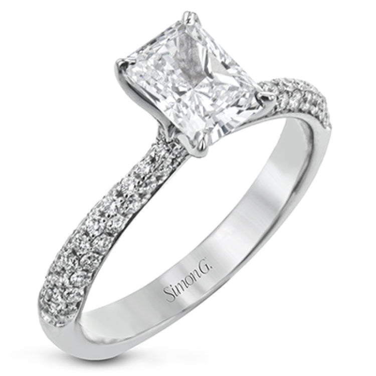 The classic design of this white gold engagement ring and wedding band set is emphasized by .72 ctw round cut white diamonds.