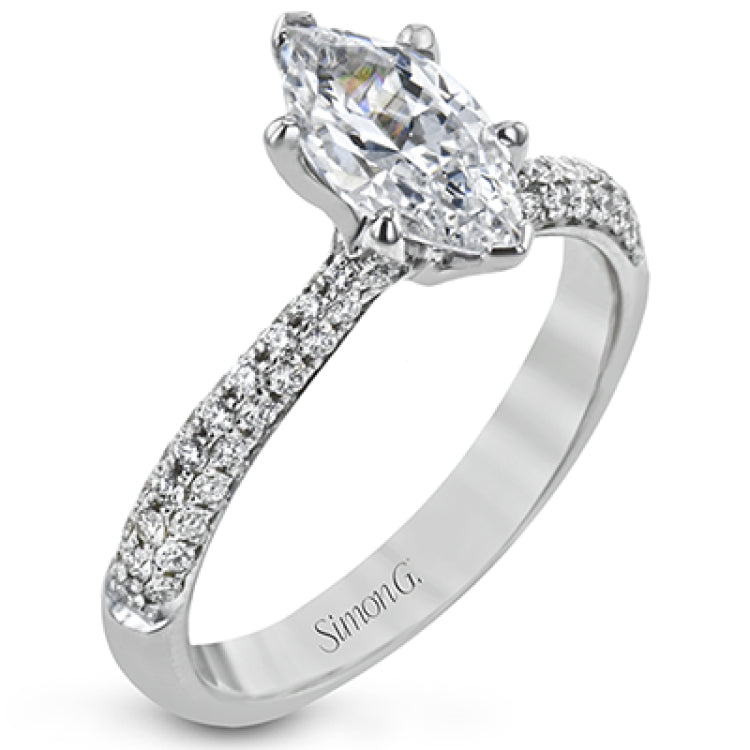 The classic design of this white gold engagement ring and wedding band set is emphasized by .72 ctw round cut white diamonds.