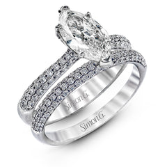 The classic design of this white gold engagement ring and wedding band set is emphasized by .72 ctw round cut white diamonds.