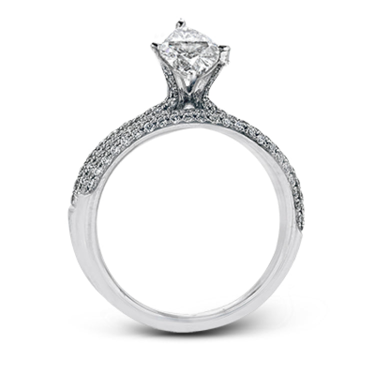 The classic design of this white gold engagement ring and wedding band set is emphasized by .72 ctw round cut white diamonds.