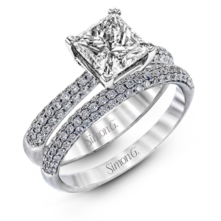 The classic design of this white gold engagement ring and wedding band set is emphasized by .72 ctw round cut white diamonds.
