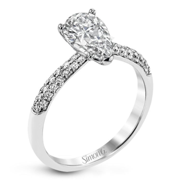 The classic design of this white gold engagement ring and wedding band set is emphasized by .72 ctw round cut white diamonds.