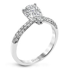 The classic design of this white gold engagement ring and wedding band set is emphasized by .72 ctw round cut white diamonds.