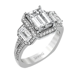 This impressive white gold ring features .43 ctw emerald cut side diamonds and is accented with .38 ctw round cut diamonds.