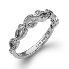 This delicate floral inspired white gold engagement ring and wedding band set is accentuated with .28 ctw shimmering round cut white diamonds.