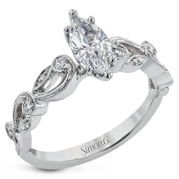 This delicate floral inspired white gold engagement ring and wedding band set is accentuated with .28 ctw shimmering round cut white diamonds.