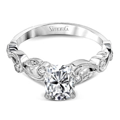 This beautiful vintage-inspired engagement ring design is built for an oval center stone and contains the perfect touches of .28 ctw of white diamonds in its midst.