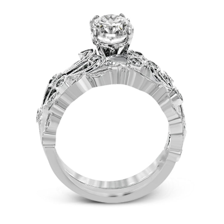 This beautiful vintage-inspired engagement ring design is built for an oval center stone and contains the perfect touches of .28 ctw of white diamonds in its midst.