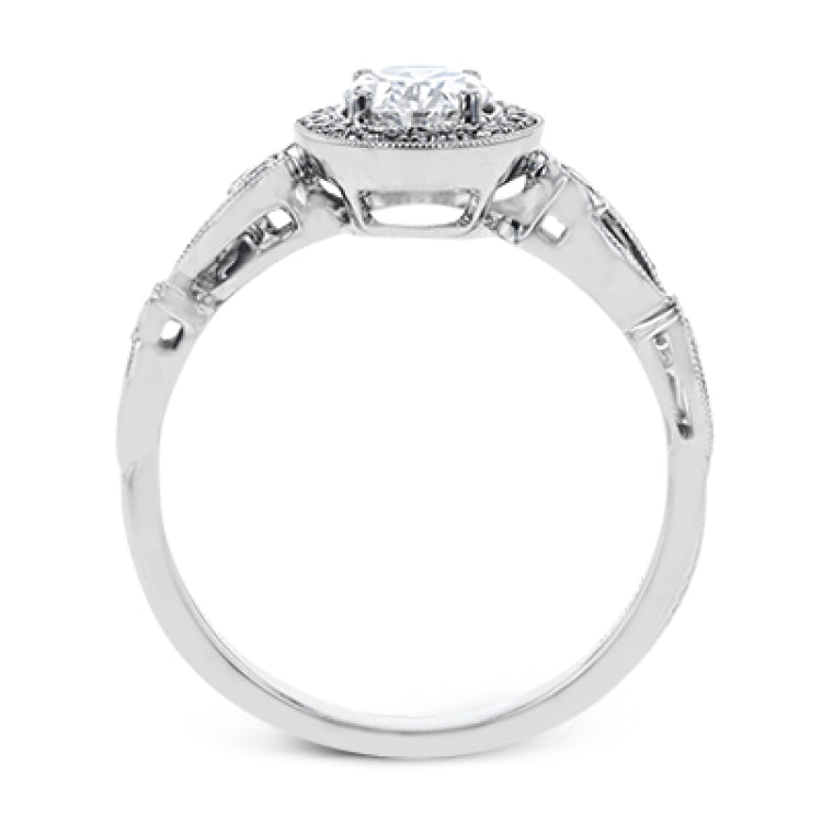Reflecting a lovely romantic design, this white gold classic engagement ring features .16 ctw round cut white diamond accents.